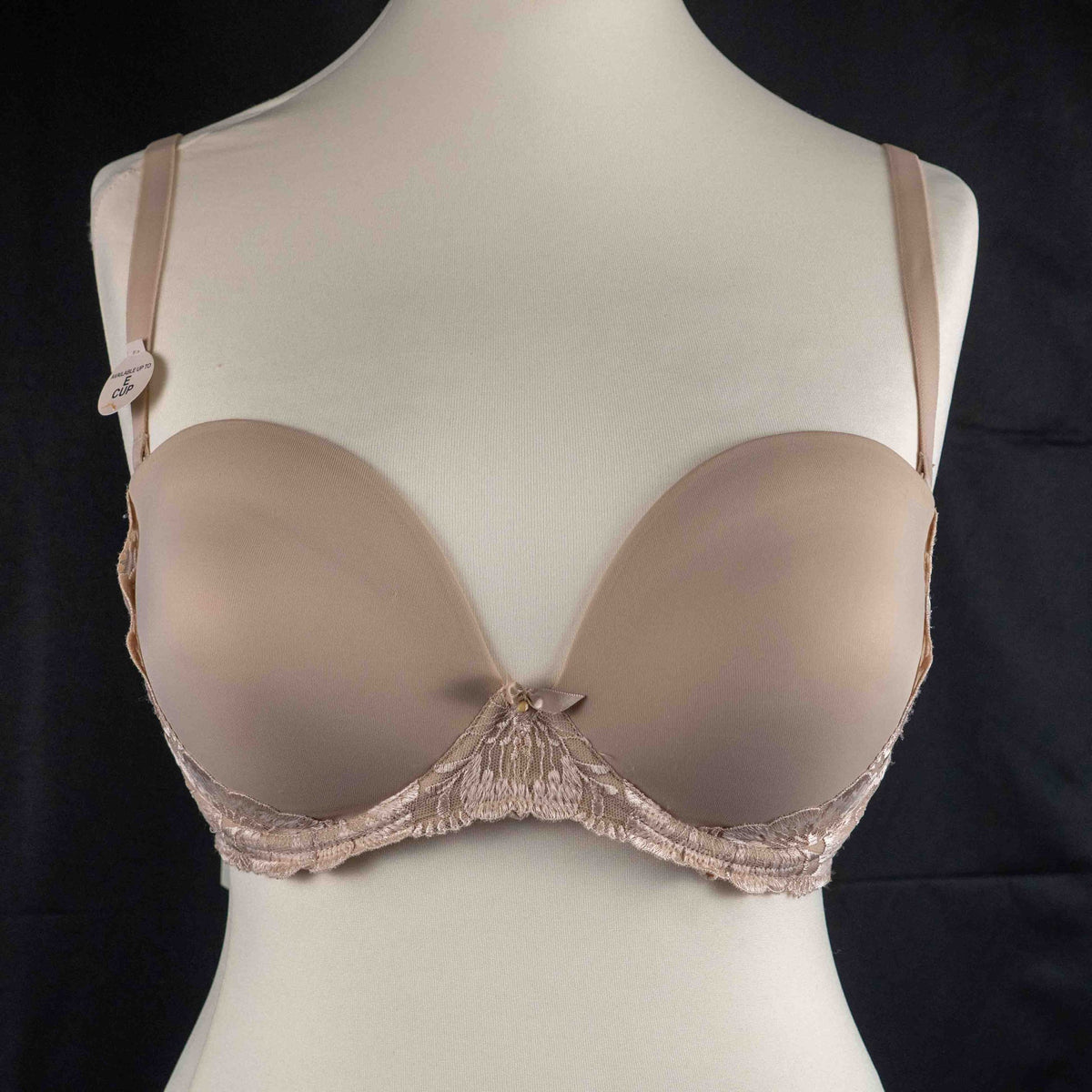 Marks and Spencer beige padded underwired bra with floral lace detail and decorative bow.