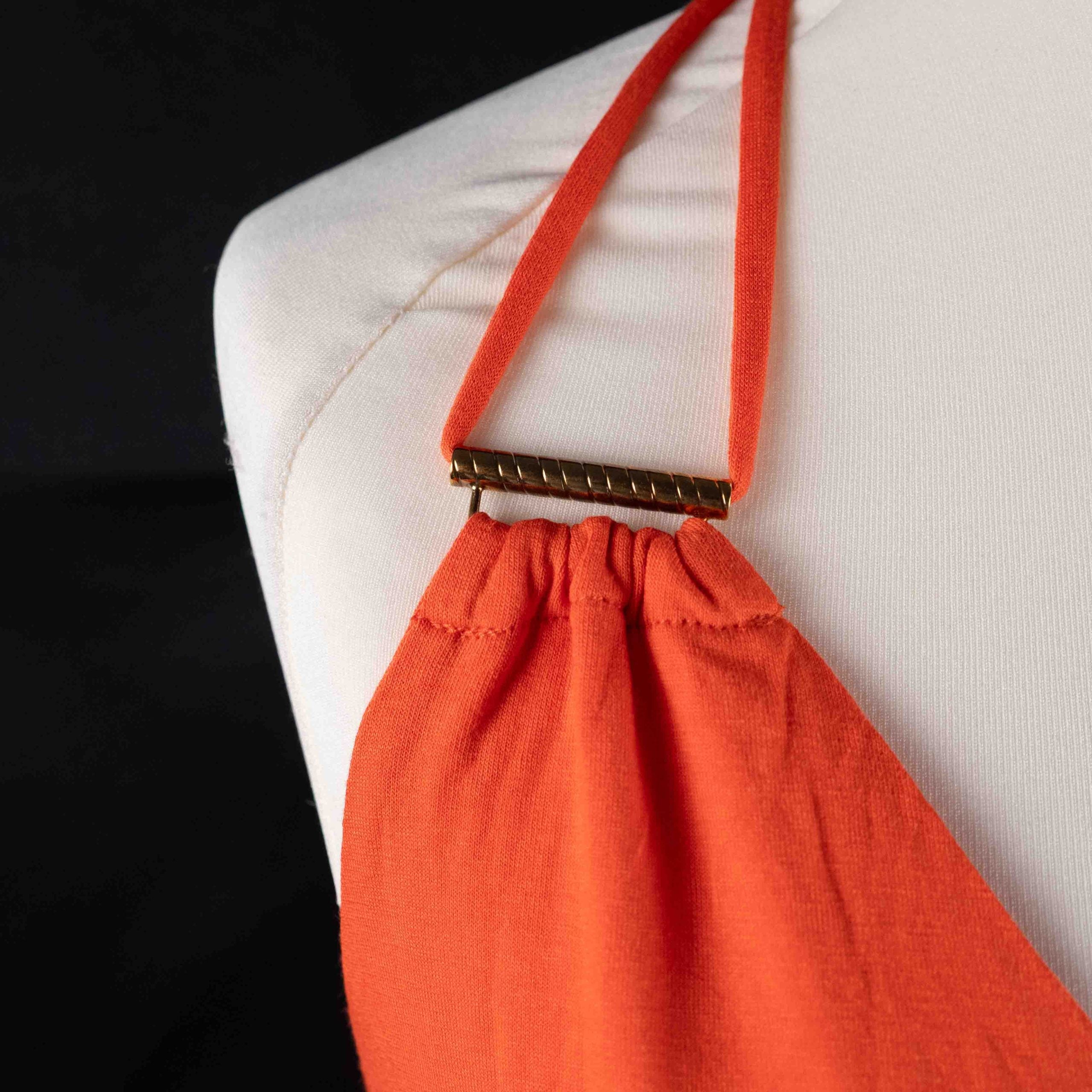 Bisbigli orange maxi dress with gold bar detailing on shoulder straps, lace material.
