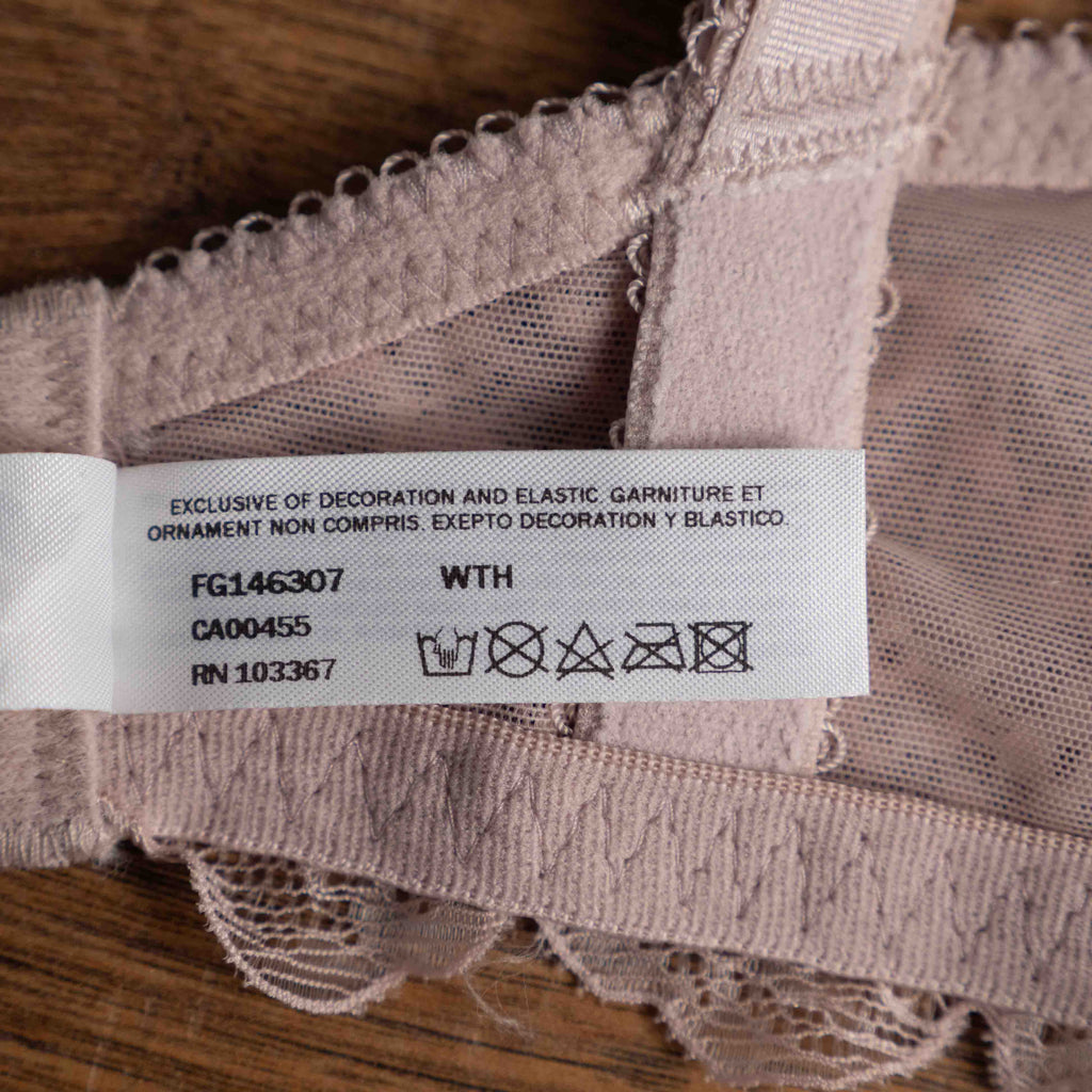 Wacoal dusty pink underwired bra with delicate lace detailing and adjustable straps.