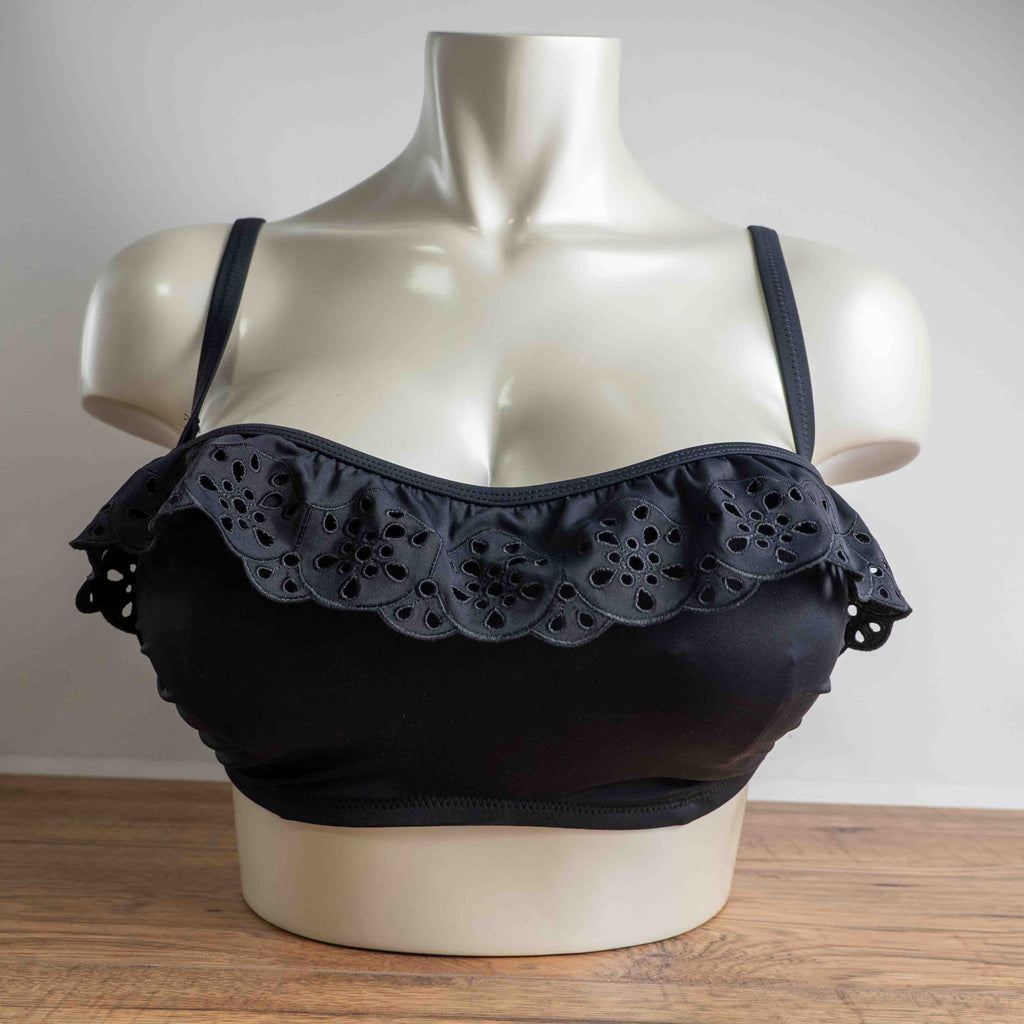 Pour Moi black bikini top with eyelet ruffle detail and adjustable straps.