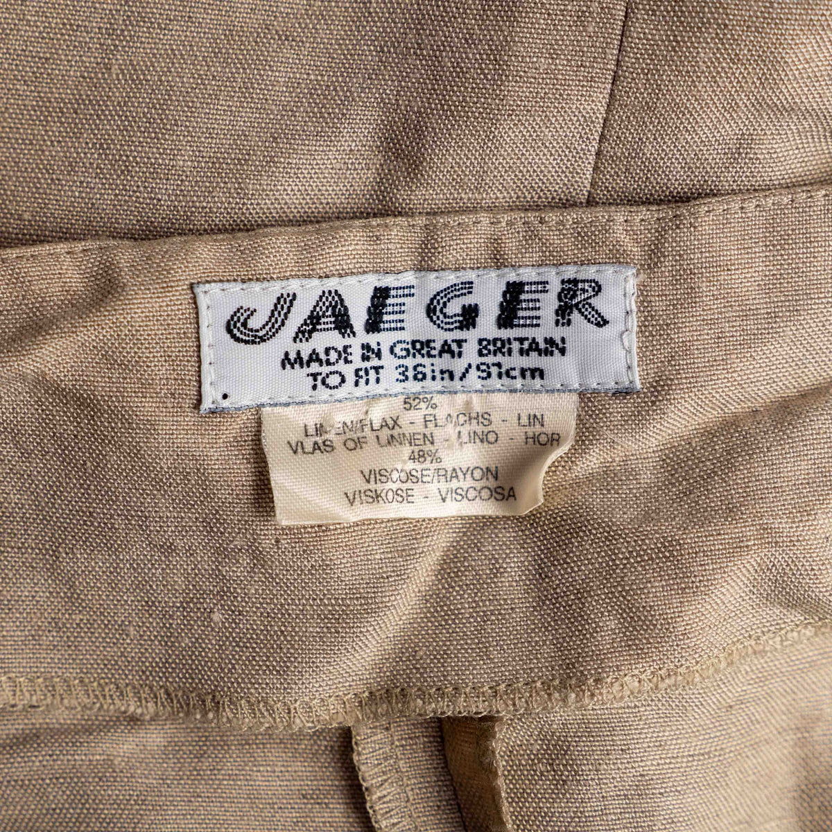 Jaeger beige linen tunic blouse with wooden buttons and back vent detail.