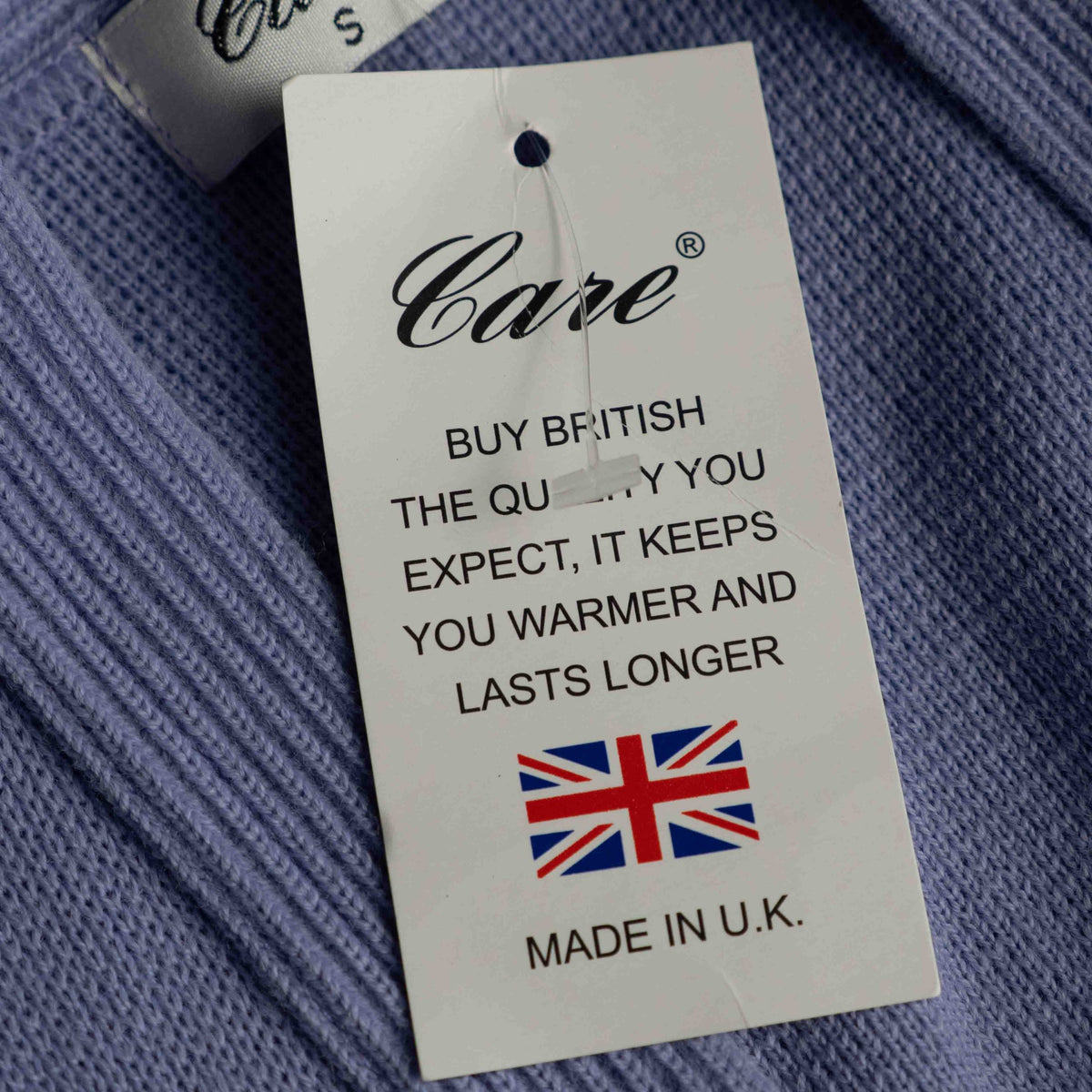 Care lilac cardigan with V-neck, five buttons, two pockets, ribbed trim.