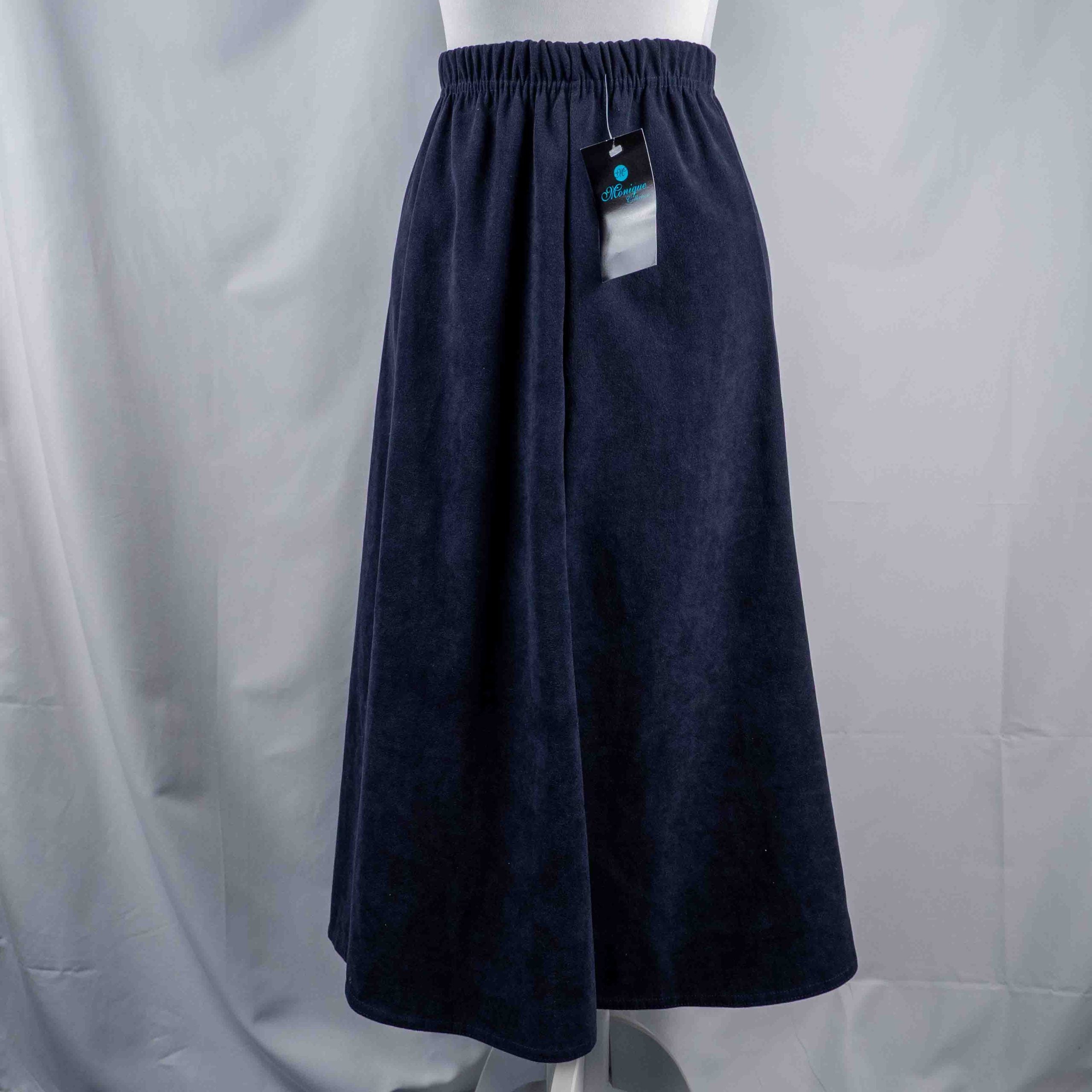 Monique navy velvet long skirt with elastic waistband and flared silhouette.