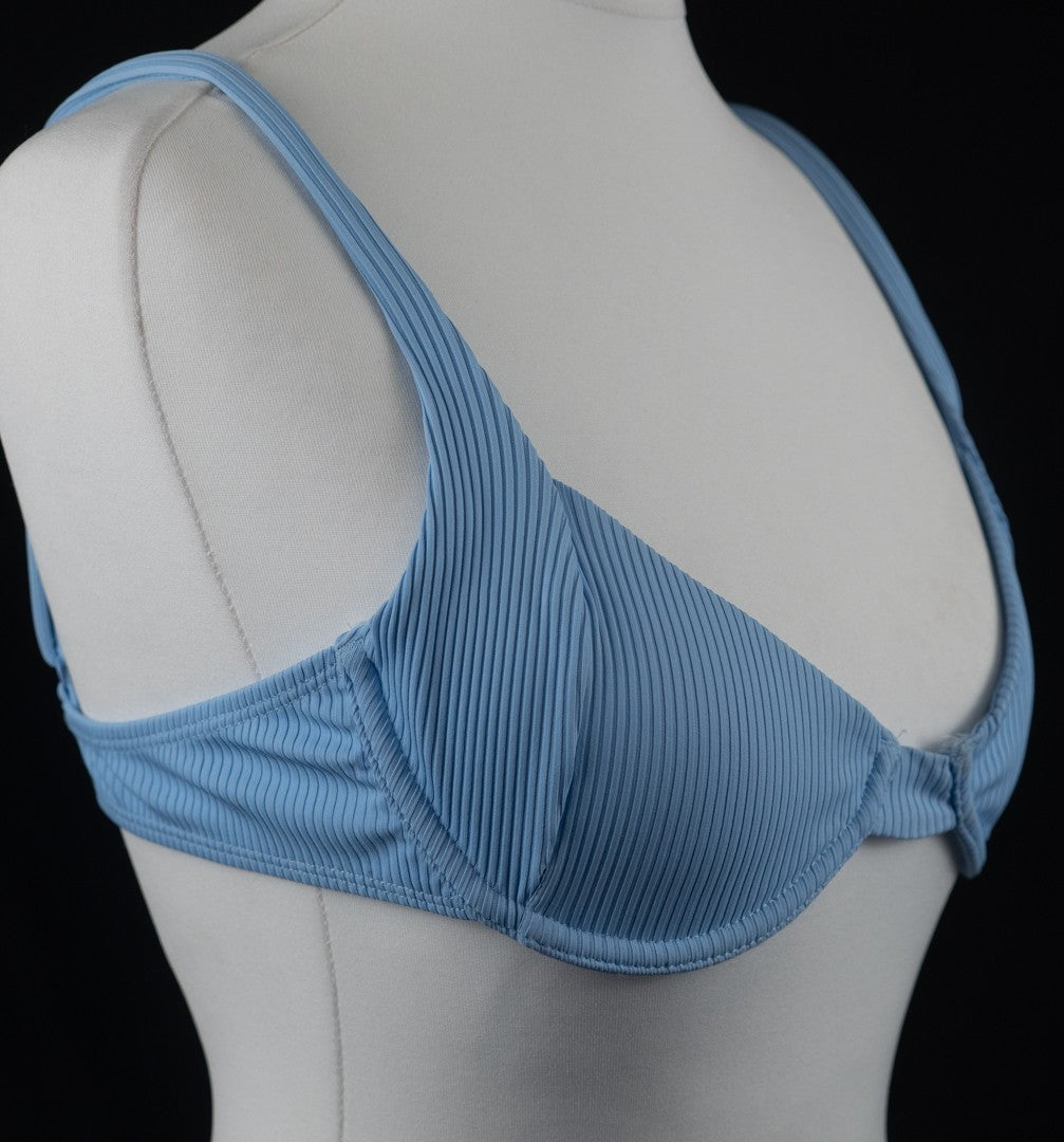 Bershka blue bikini top with line pattern, underwired, padded, and back buckle closure.