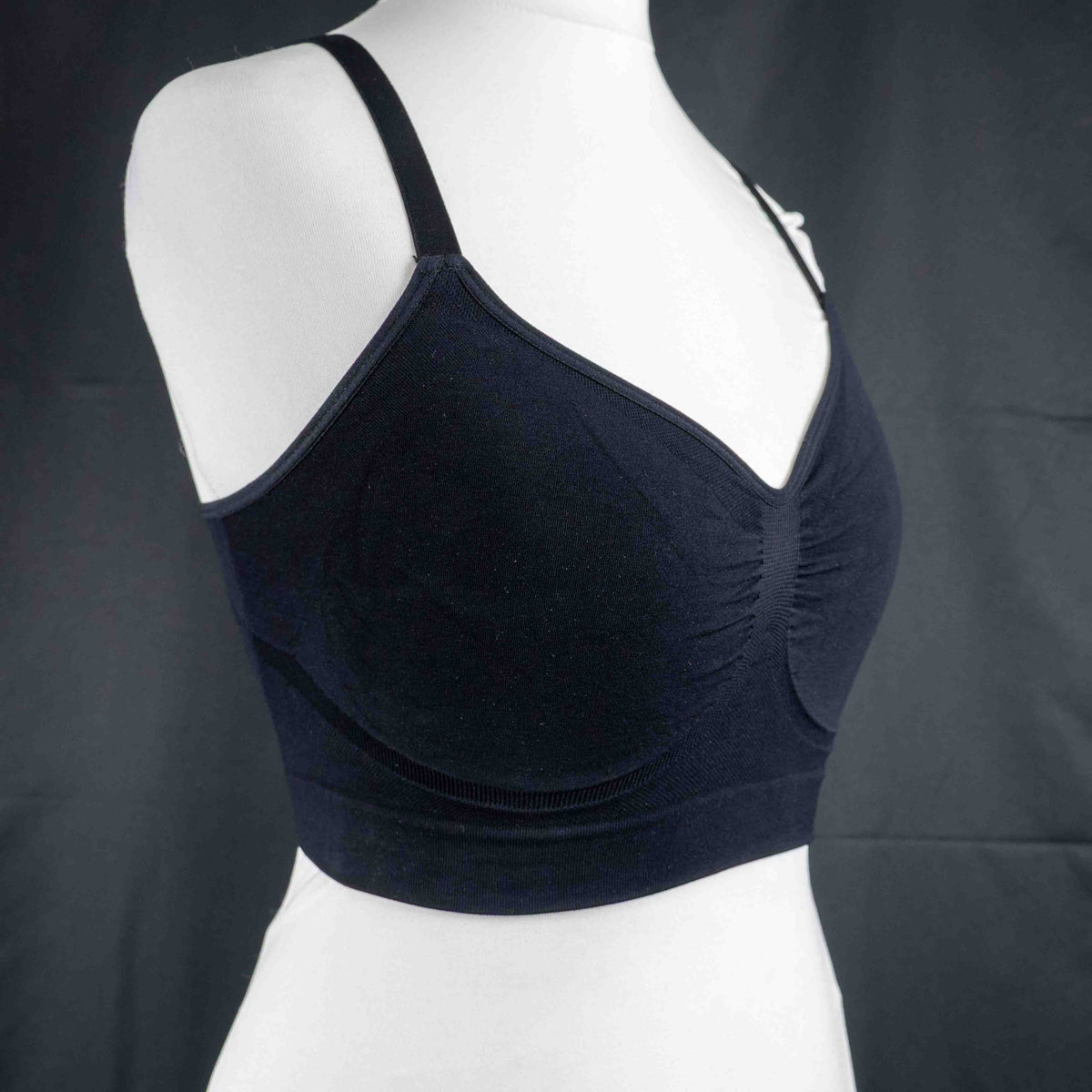 Dyversa black seamless bra with ruched center detail and adjustable straps.
