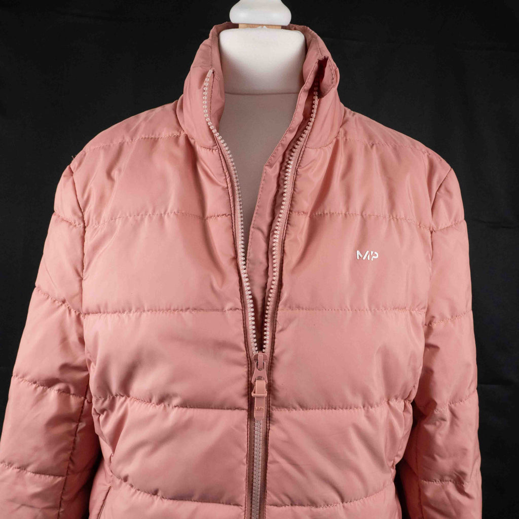 MP pink zip up puffer jacket with horizontal quilting and minimal logo on chest.