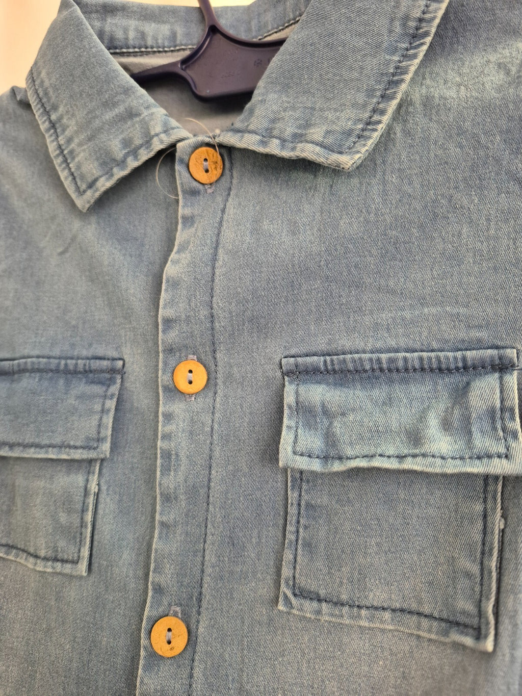 Lingxibeier blue denim jumpsuit with giraffe pattern, long sleeves, and front pockets.