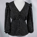 New Look black and white polka dot tunic blouse with V-neck and ruffled sleeves.