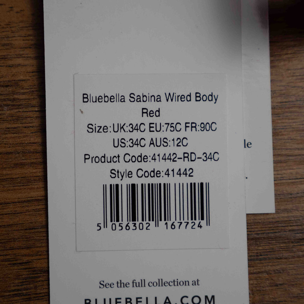 Bluebella red wired body with sheer mesh panels and floral embroidery details.