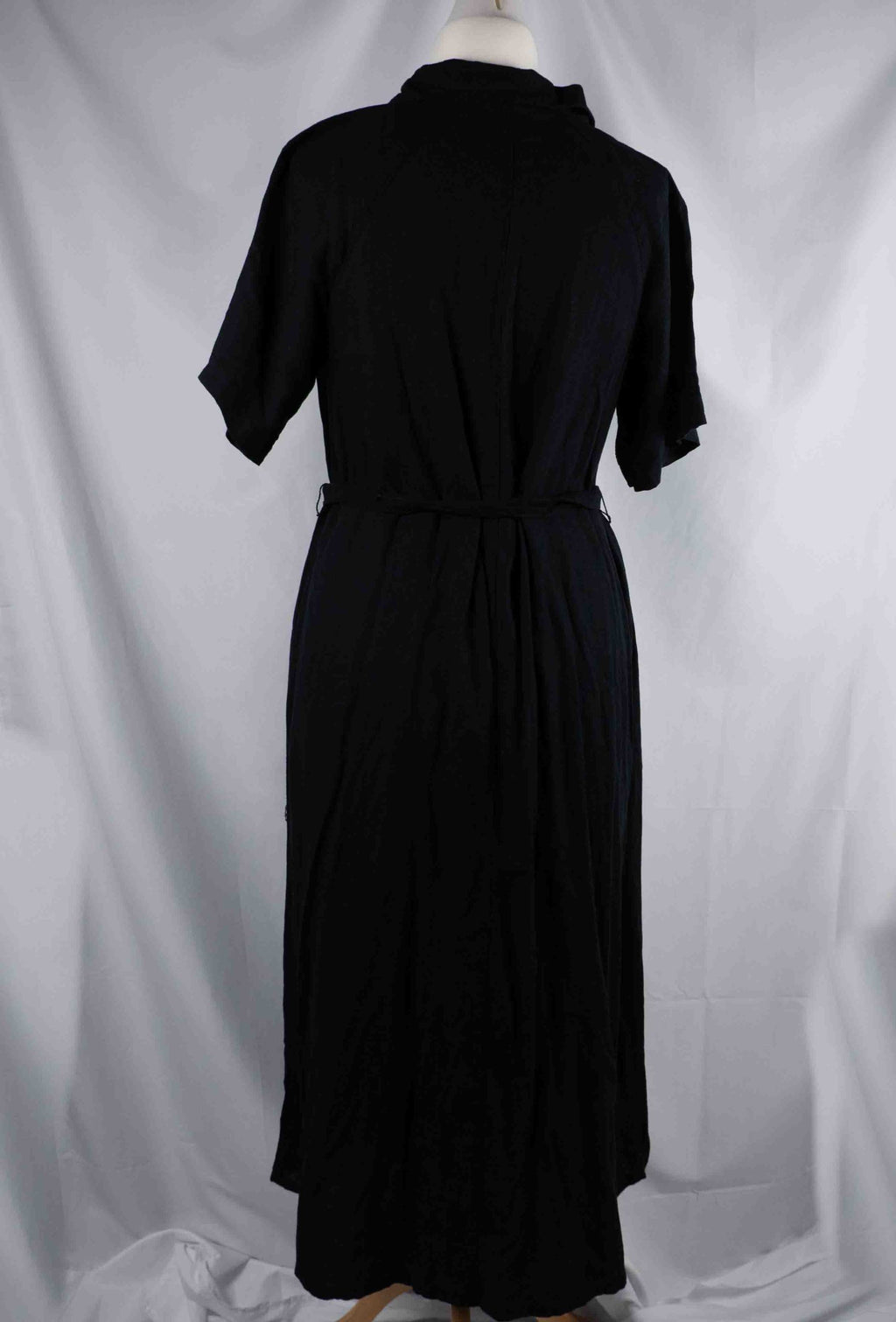 Papaya black shirt dress with button-down front, matching belt, and chest pockets.