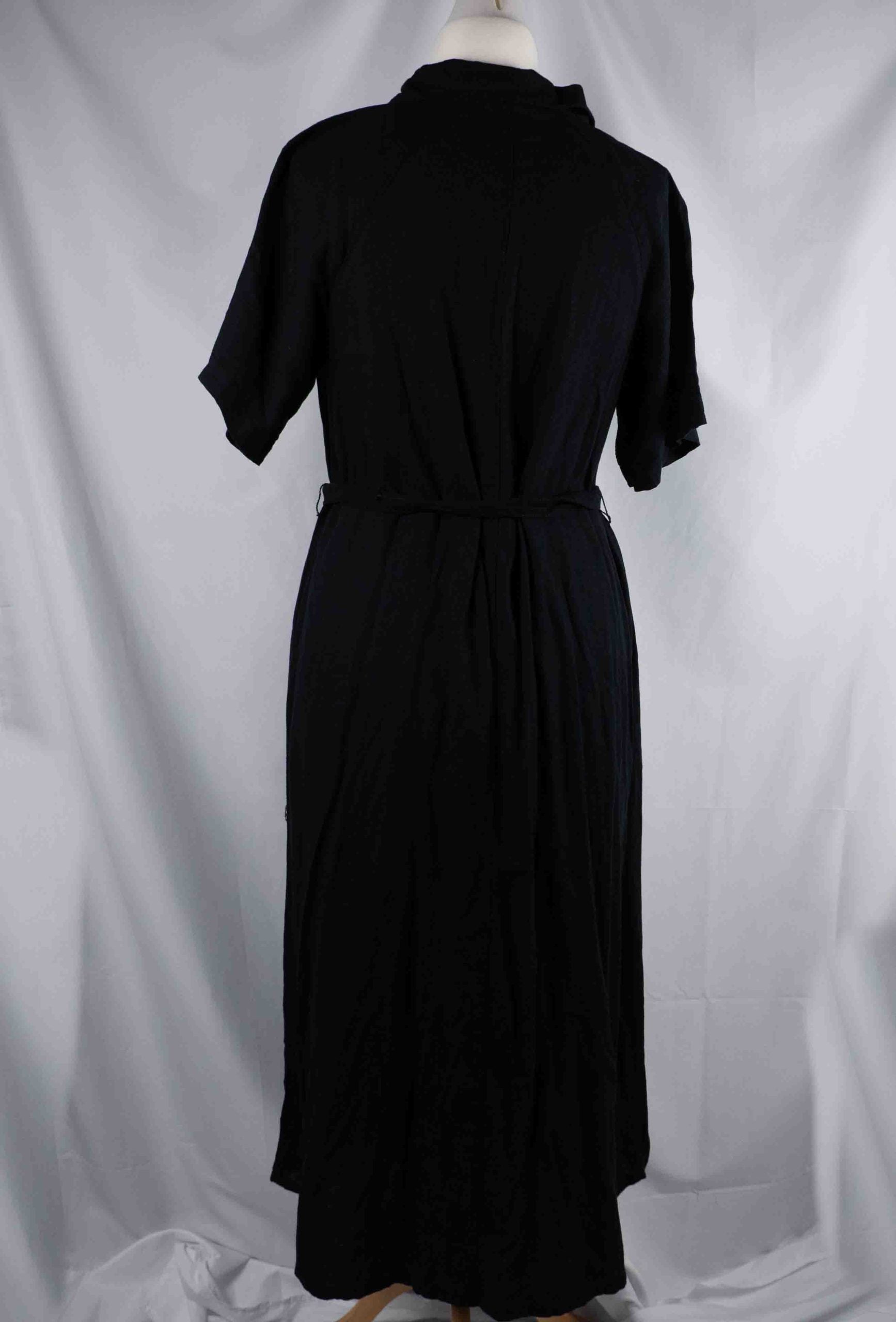 Papaya black shirt dress with button-down front, matching belt, and chest pockets.