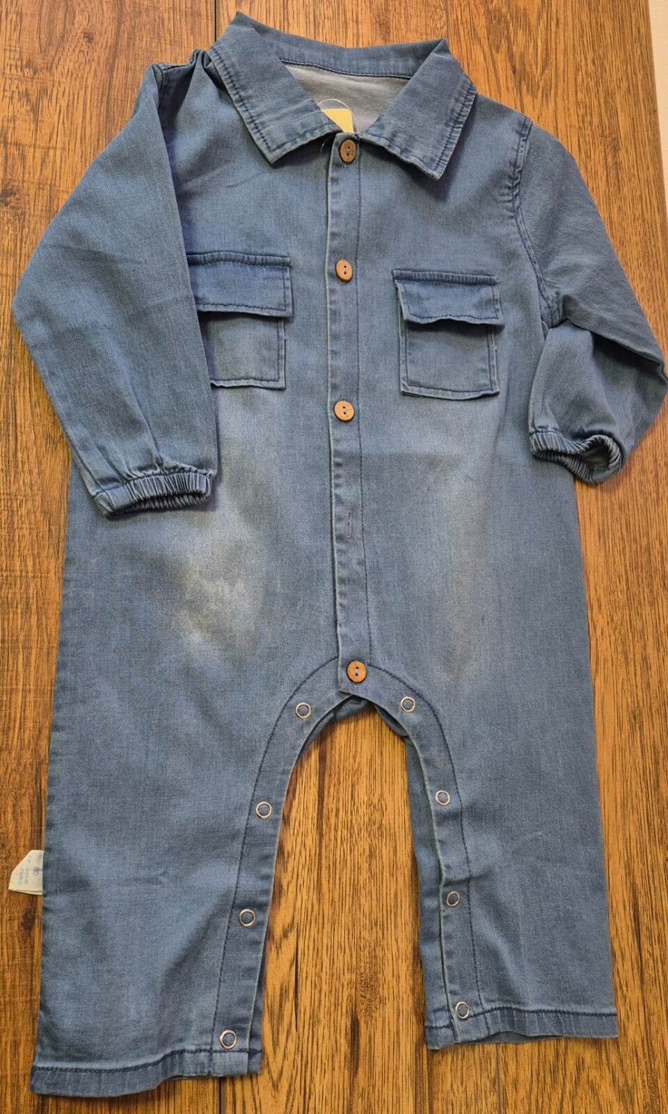 Lingxibeier blue denim jumpsuit with giraffe pattern, long sleeves, and front pockets.