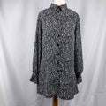 Missguided black and white spot print shirt with button-down front and flared cuffs.