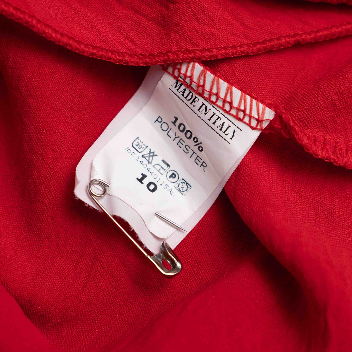 Boohoo red wrap crop top with floral print, ruffle cuffs, and tie-back design.