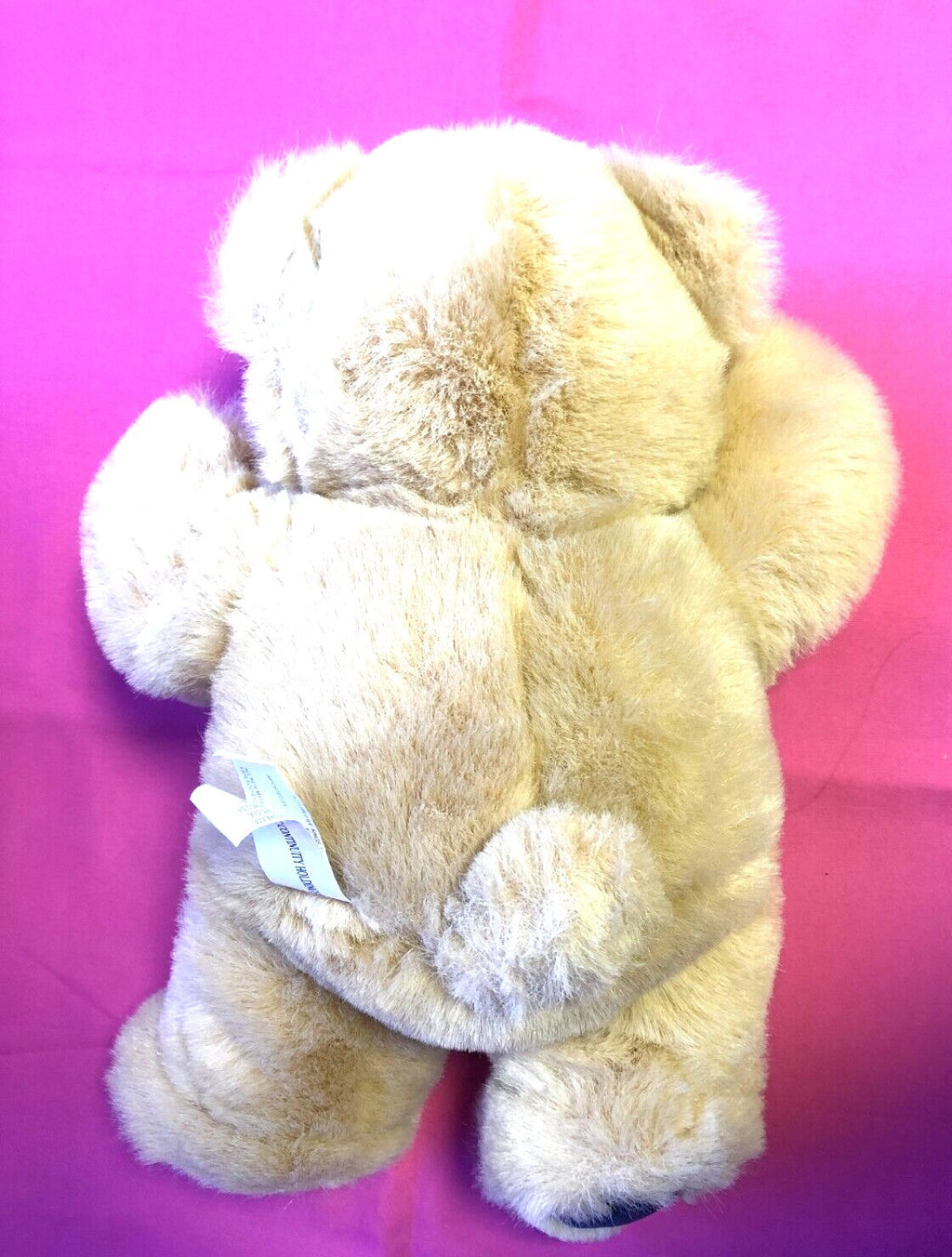 Kings Toys beige teddy bear with blue and red dickie bow, plush material.