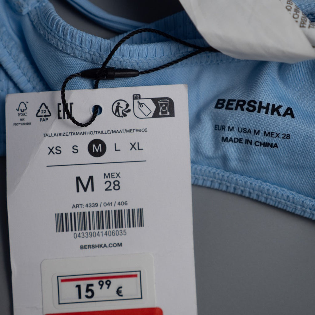 Bershka blue bikini top with line pattern, underwired, padded, and back buckle closure.
