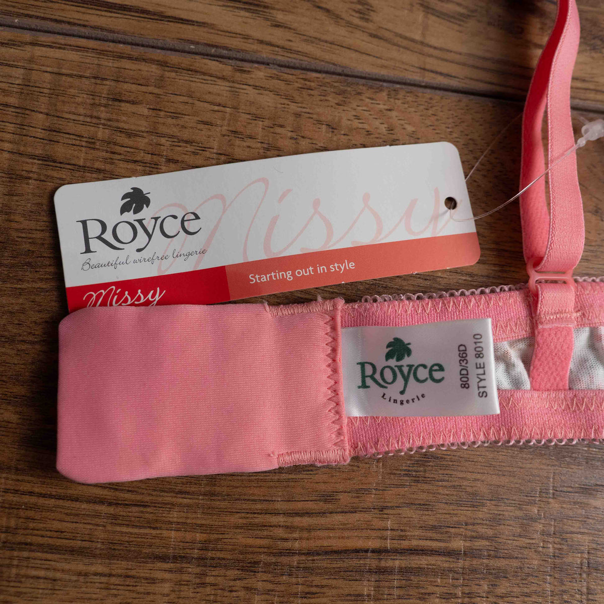 Royce white floral wire-free bra with pink straps and small pink bow detail.