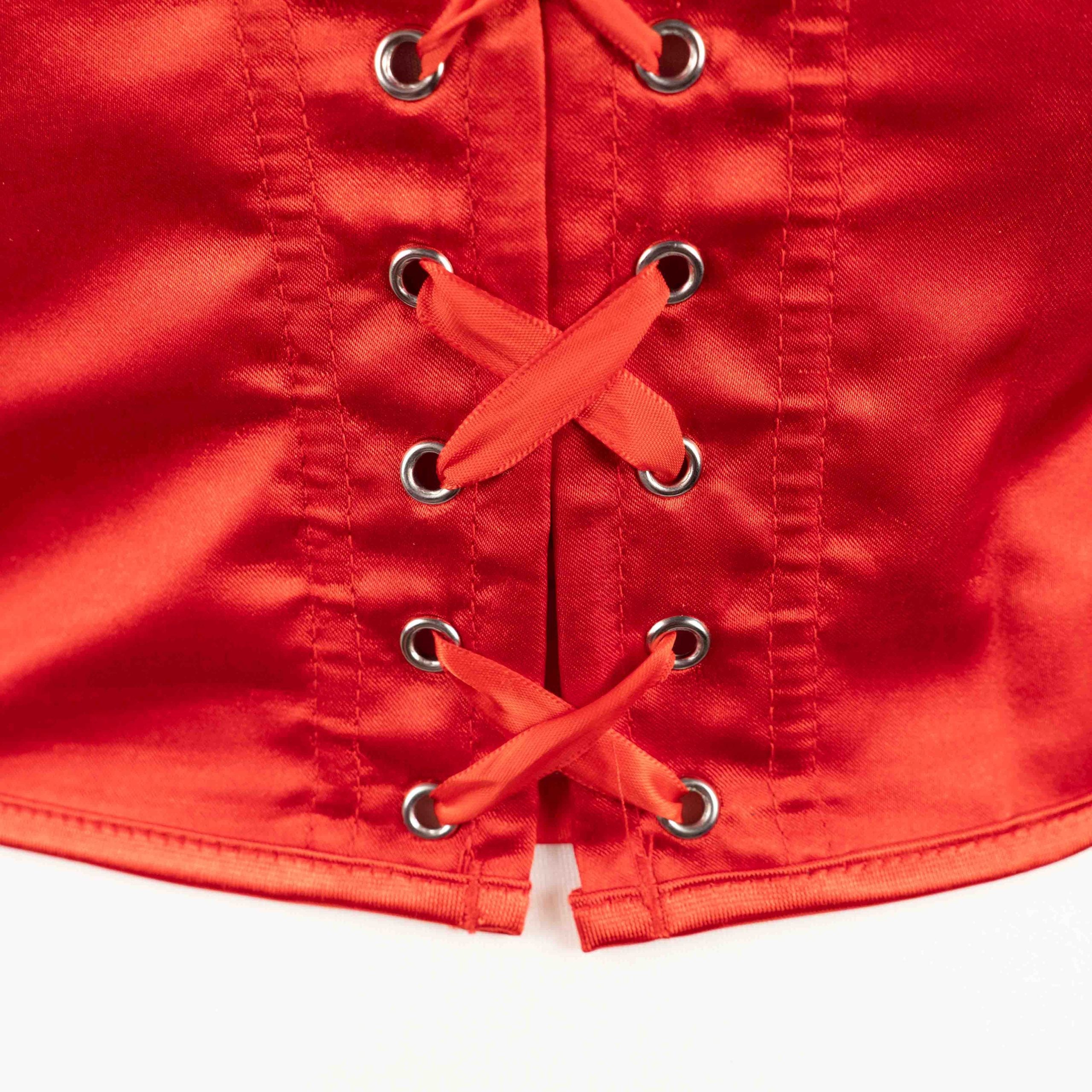 Red corset top with sheer floral lace bodice and satin sides, adjustable lace-up back.