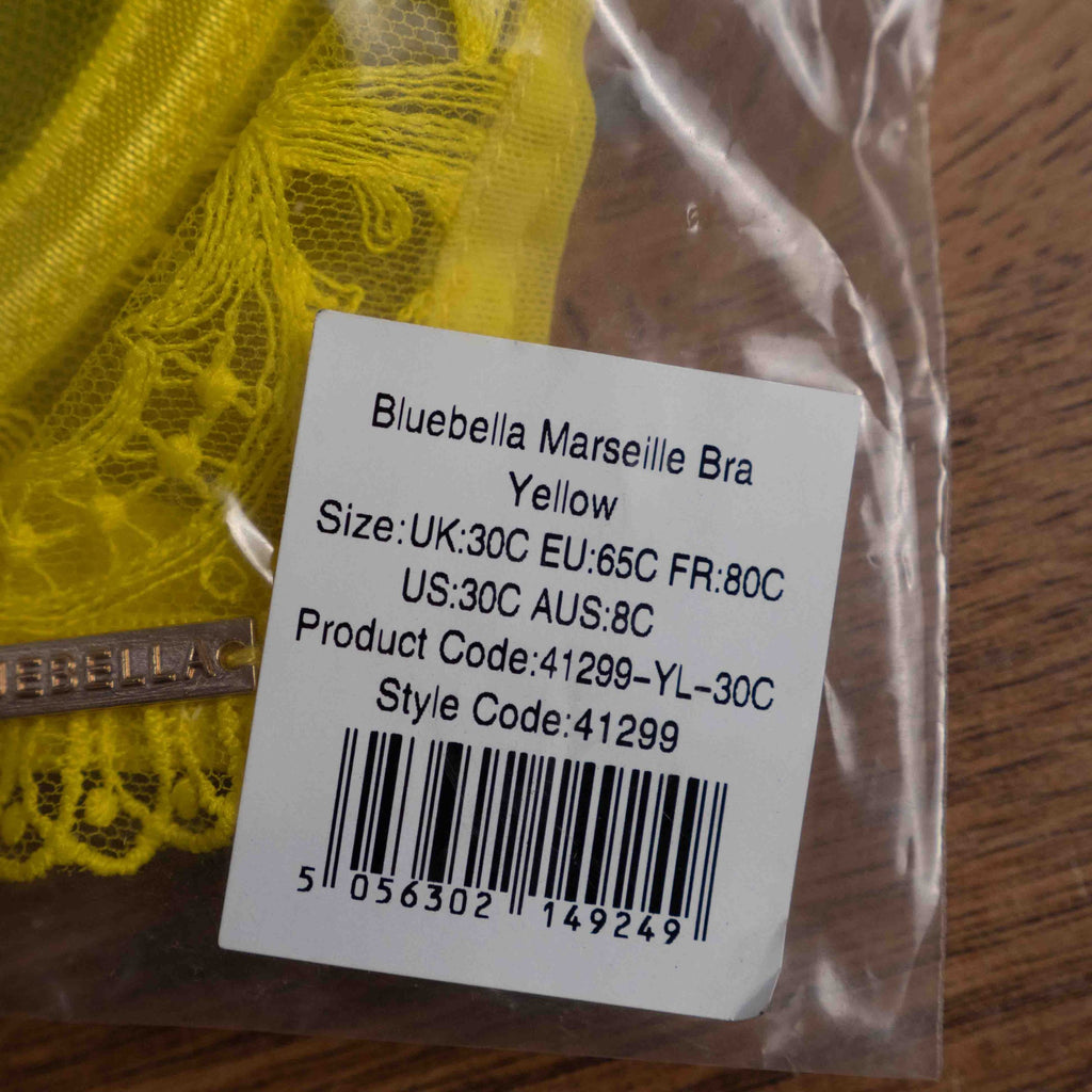 Bluebella yellow sheer lace bra with floral pattern and adjustable straps.