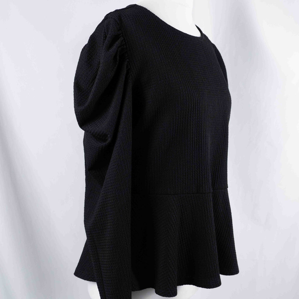 Dorothy Perkins black blouse with peplum hem and textured puff sleeves.