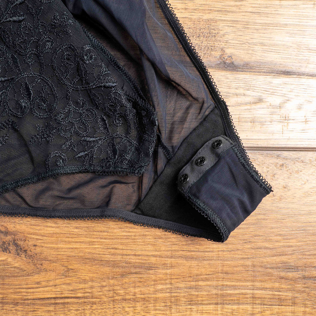 Empreinte black shapewear bodysuit with lace detailing, underwired cups, adjustable straps.