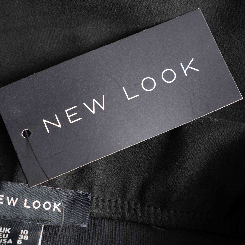 New Look black leggings with elasticated waistband and central line detail, size 10.