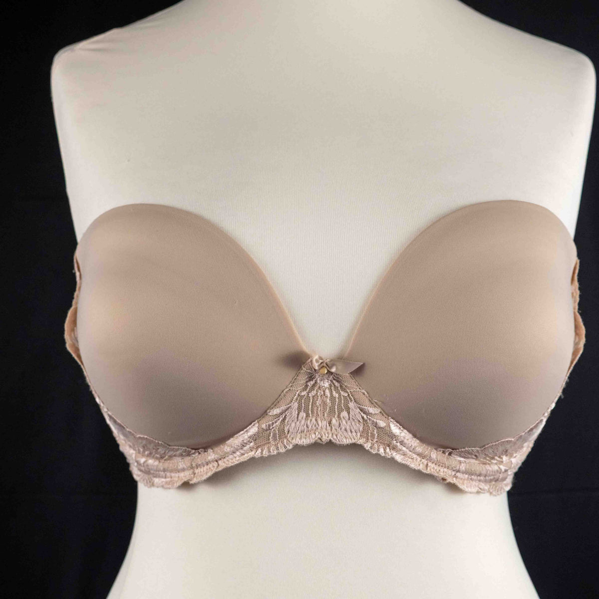 Marks and Spencer beige padded underwired bra with floral lace detail and decorative bow.
