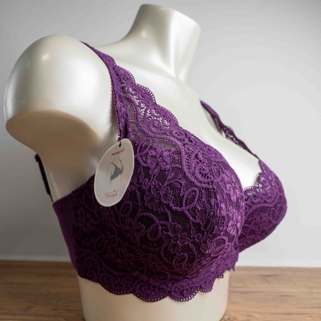 Triumph purple bra with floral lace pattern, adjustable straps, and hook-and-eye closure.
