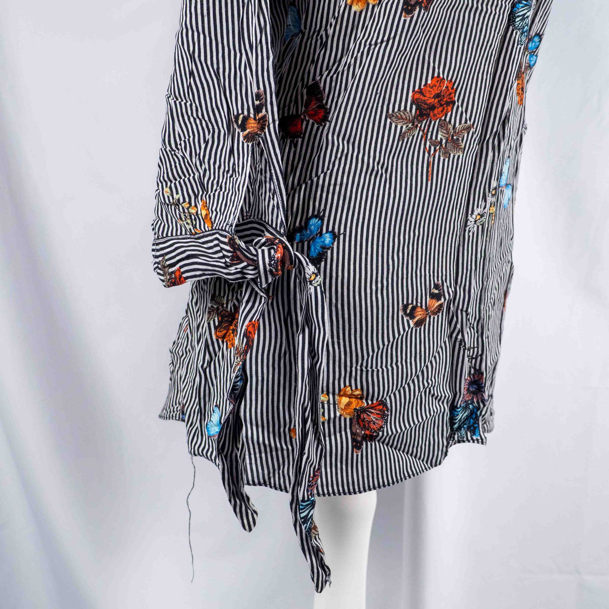 Dorothy Perkins black and white striped blouse with colourful butterfly print and tie cuffs.