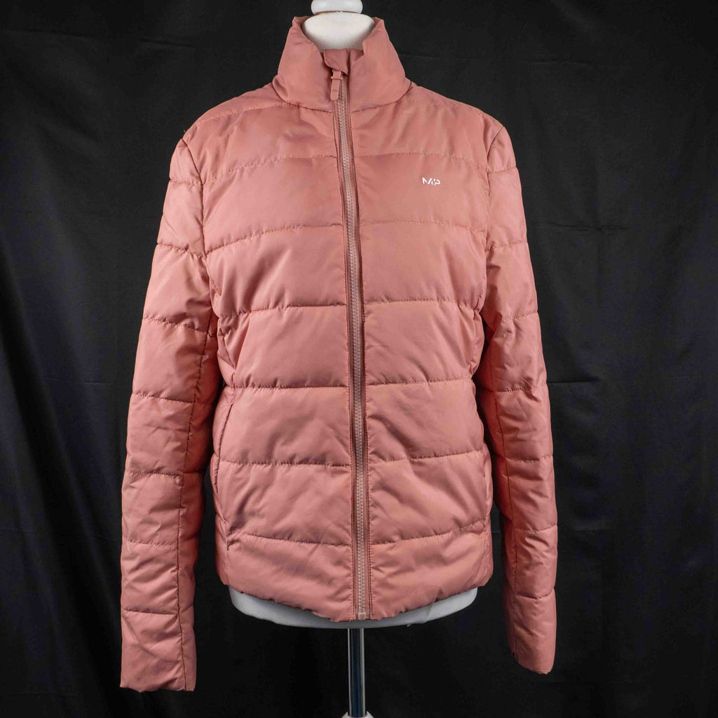 MP pink zip up puffer jacket with horizontal quilting and minimal logo on chest.