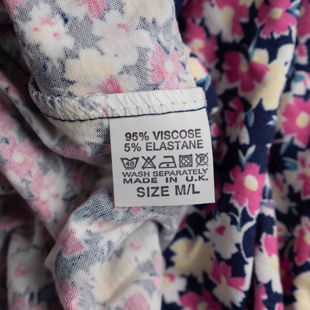 Monique Collection pink floral midi skirt with elastic waistband and soft viscose blend.