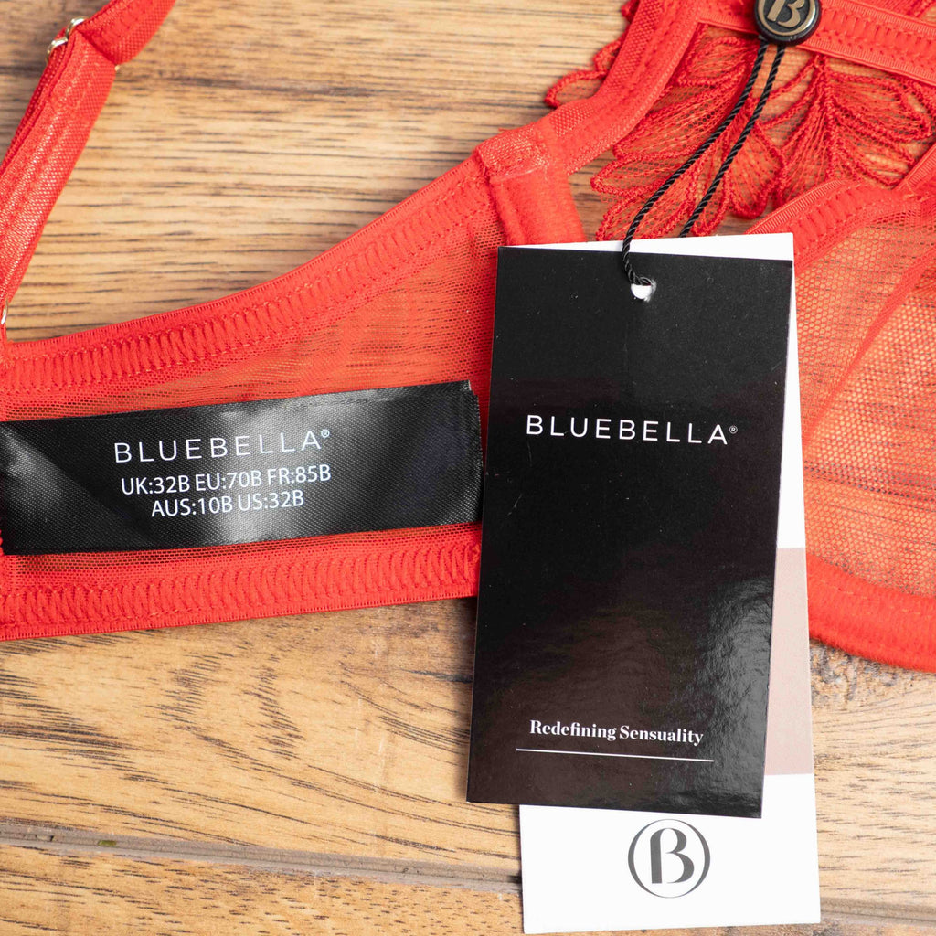 Bluebella red lace bodysuit with floral appliques and adjustable straps, underwired design.