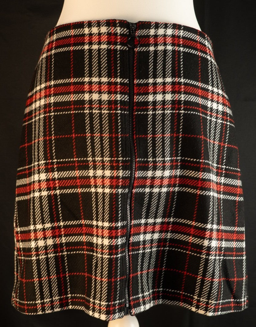 Papaya tan mini skirt black, red, and white checked pattern with zip and button closure.