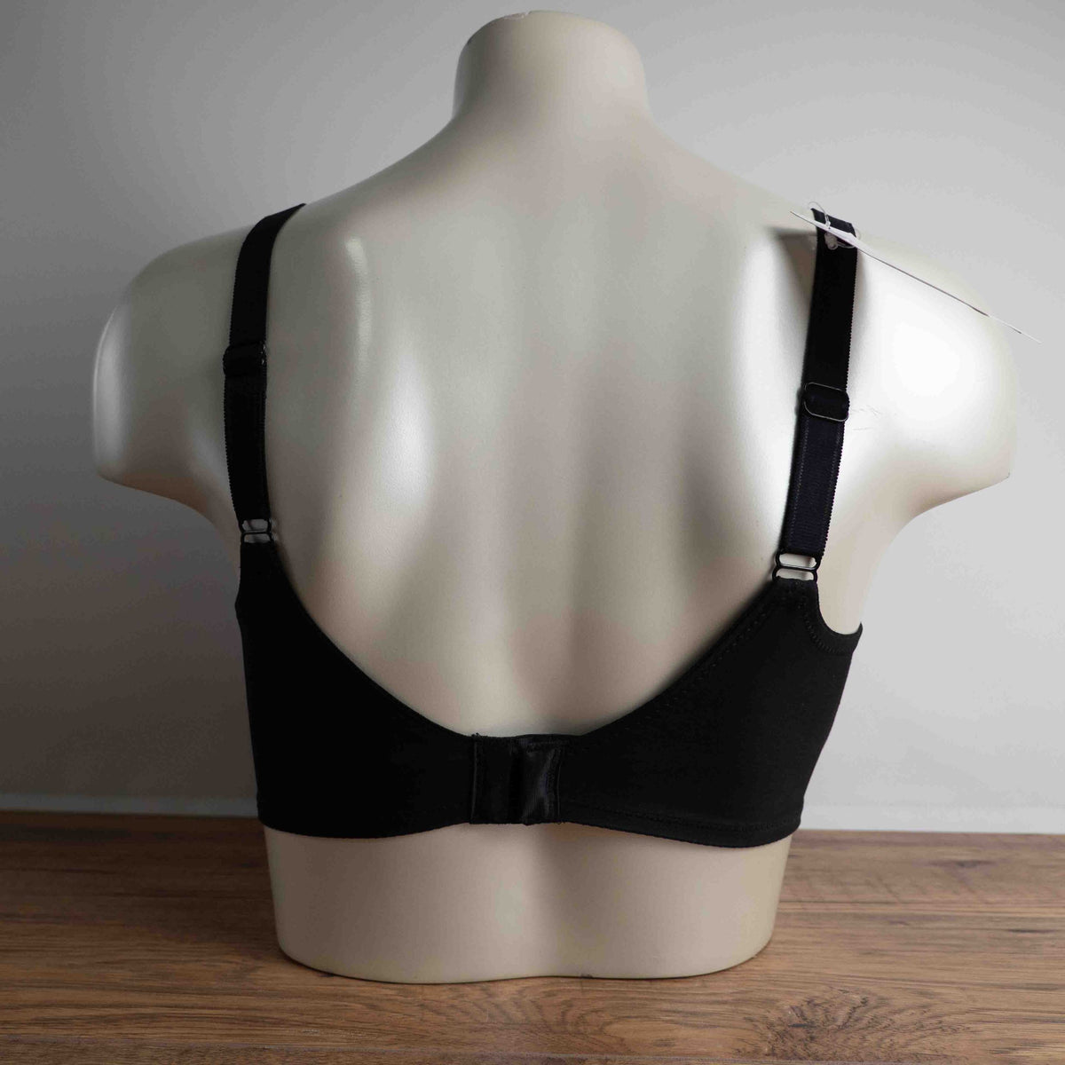M&S black lace underwired bra with floral lace upper cups and adjustable straps.