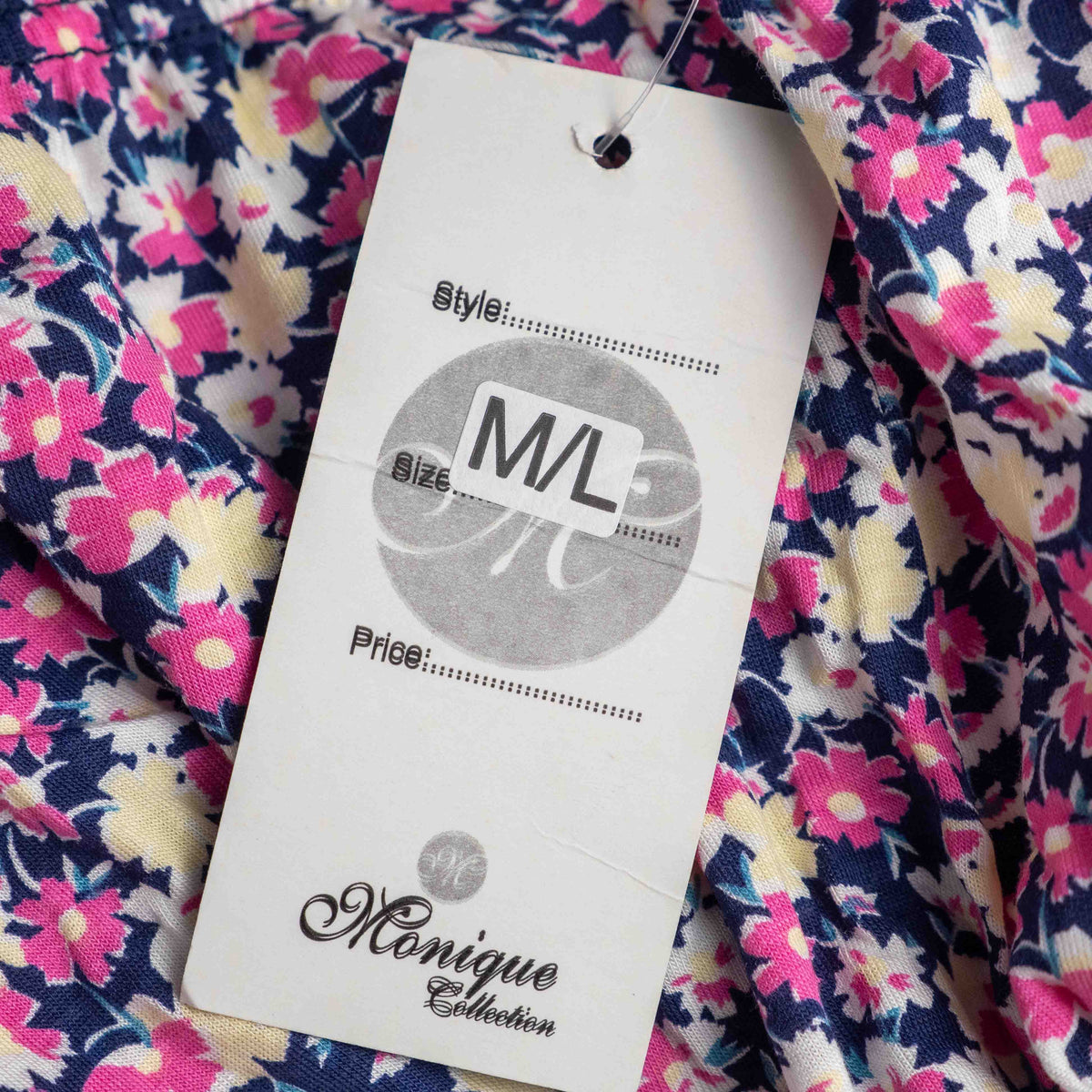 Monique Collection pink floral midi skirt with elastic waistband and soft viscose blend.