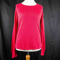 Next pink lightweight sweater with fine knit detailing on raglan sleeves and neckline.
