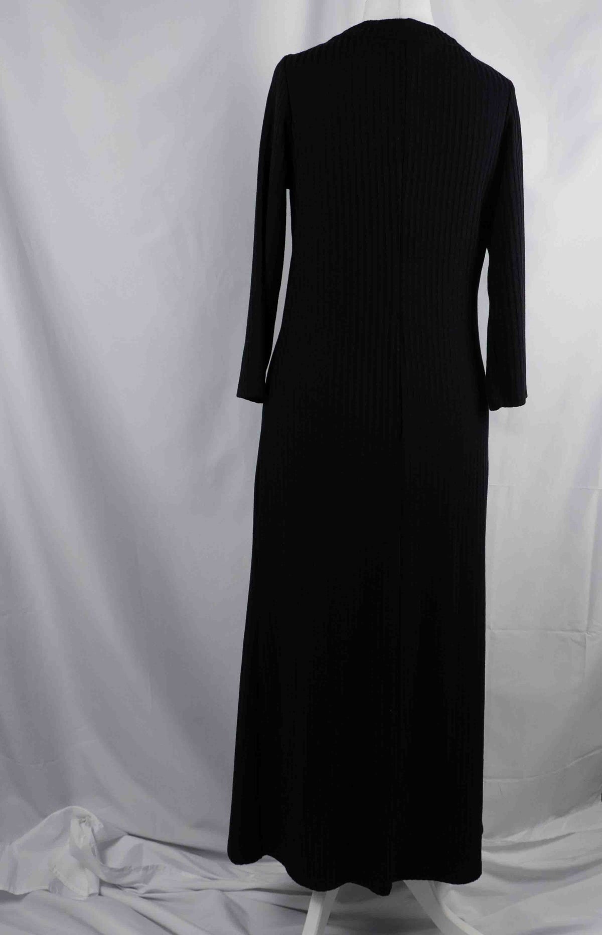 Unbranded black ribbed maxi dress with V neckline and three decorative front buttons.