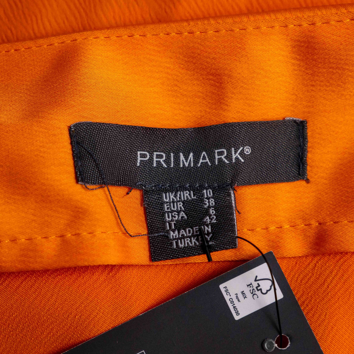 Primark orange slip dress with adjustable spaghetti straps and cowl neckline.