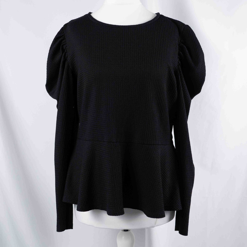 Dorothy Perkins black blouse with peplum hem and textured puff sleeves.