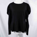 Dorothy Perkins black blouse with peplum hem and textured puff sleeves.