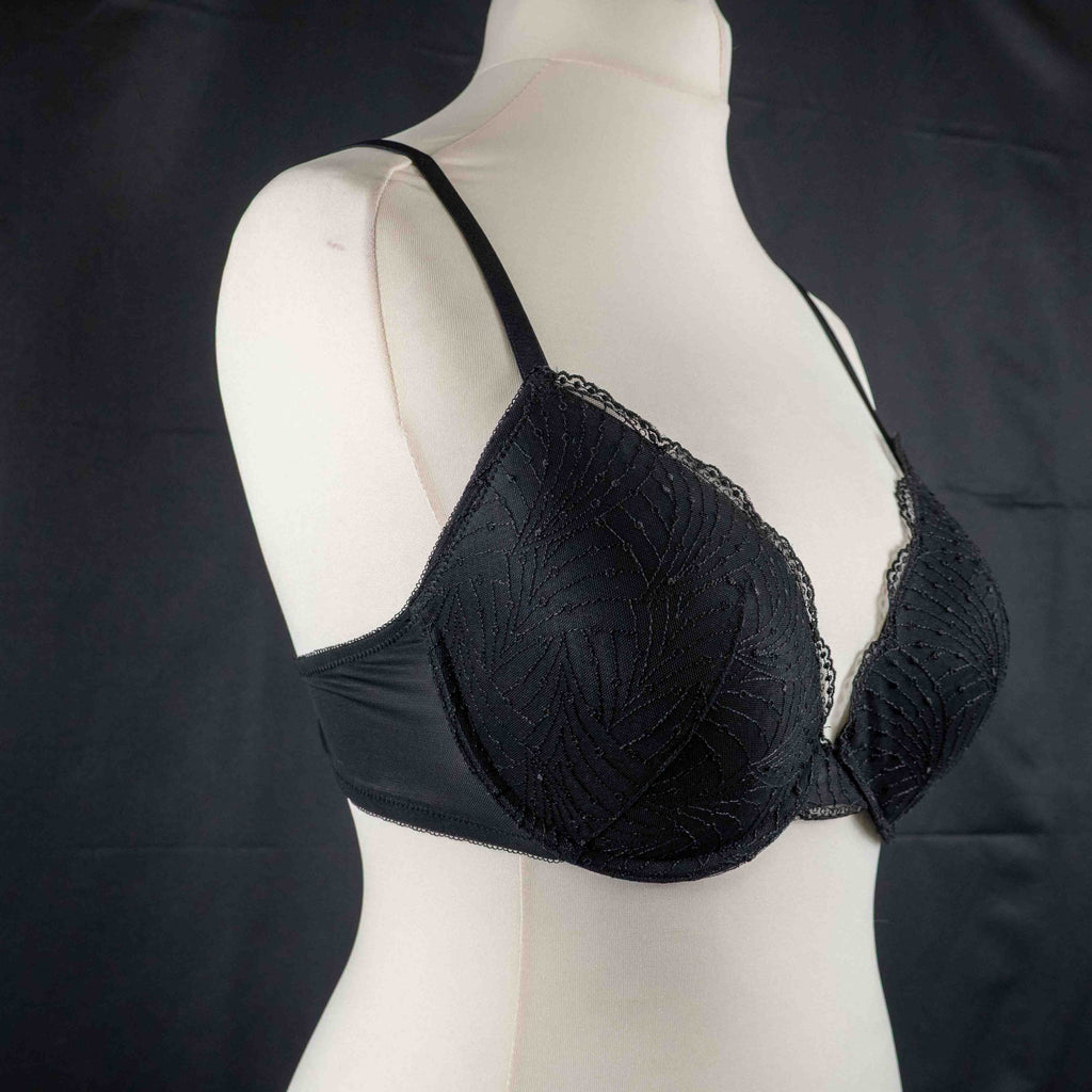Wacoal beige and black underwired bras with floral lace design and adjustable straps.