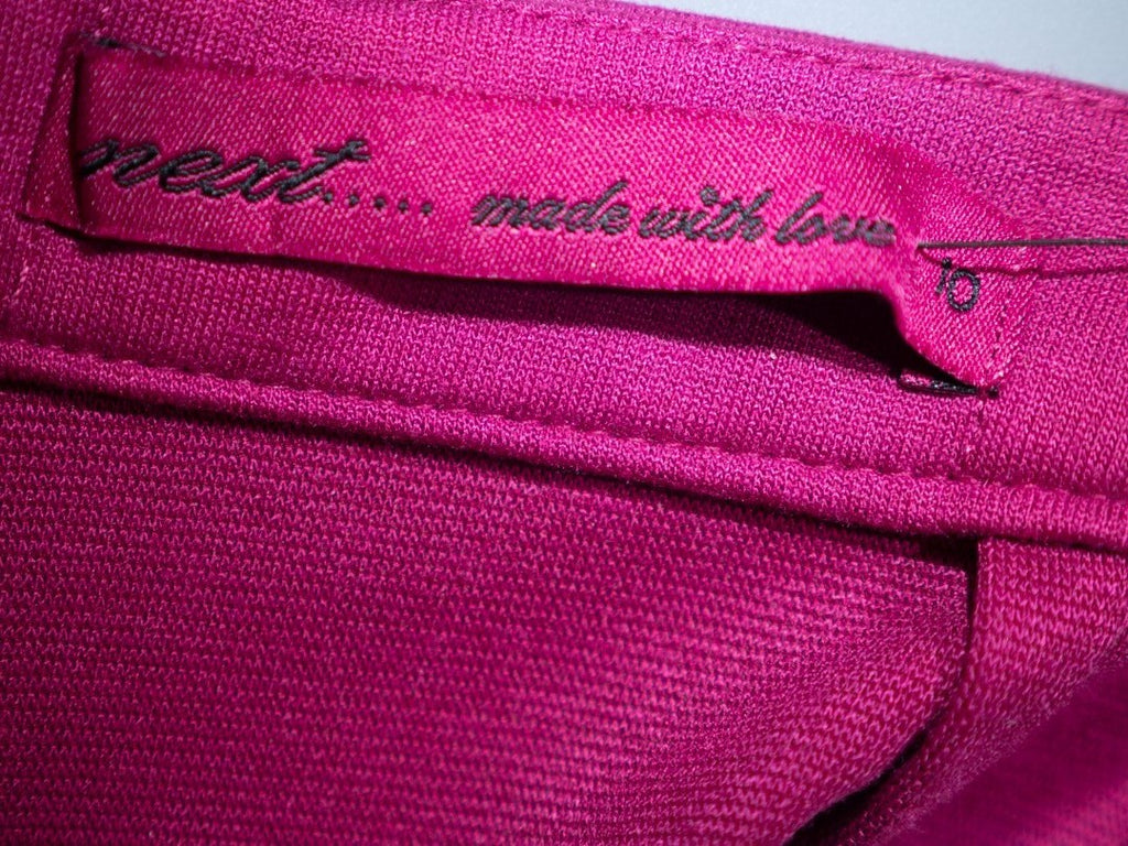 Next pink mini skirt with back zip closure and pleated front, new with tag.