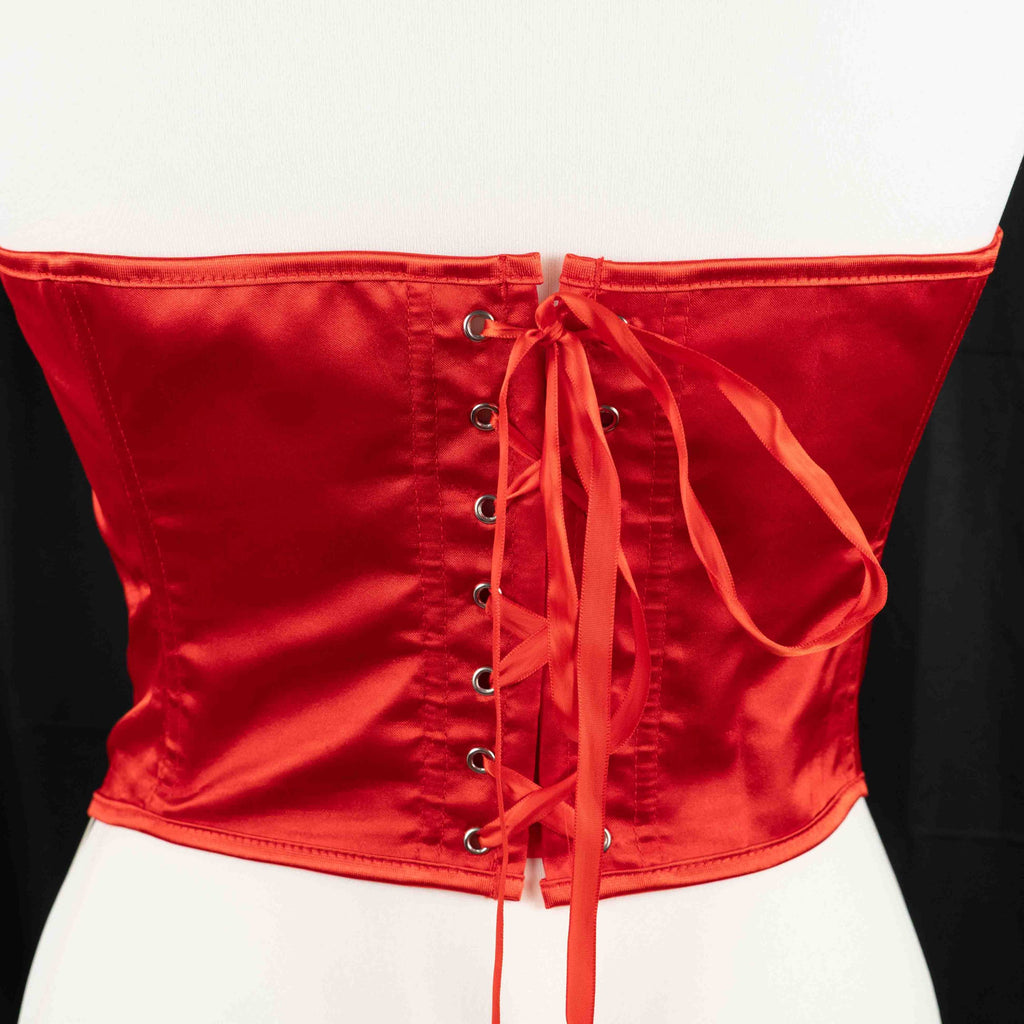 Red corset top with sheer floral lace bodice and satin sides, adjustable lace-up back.