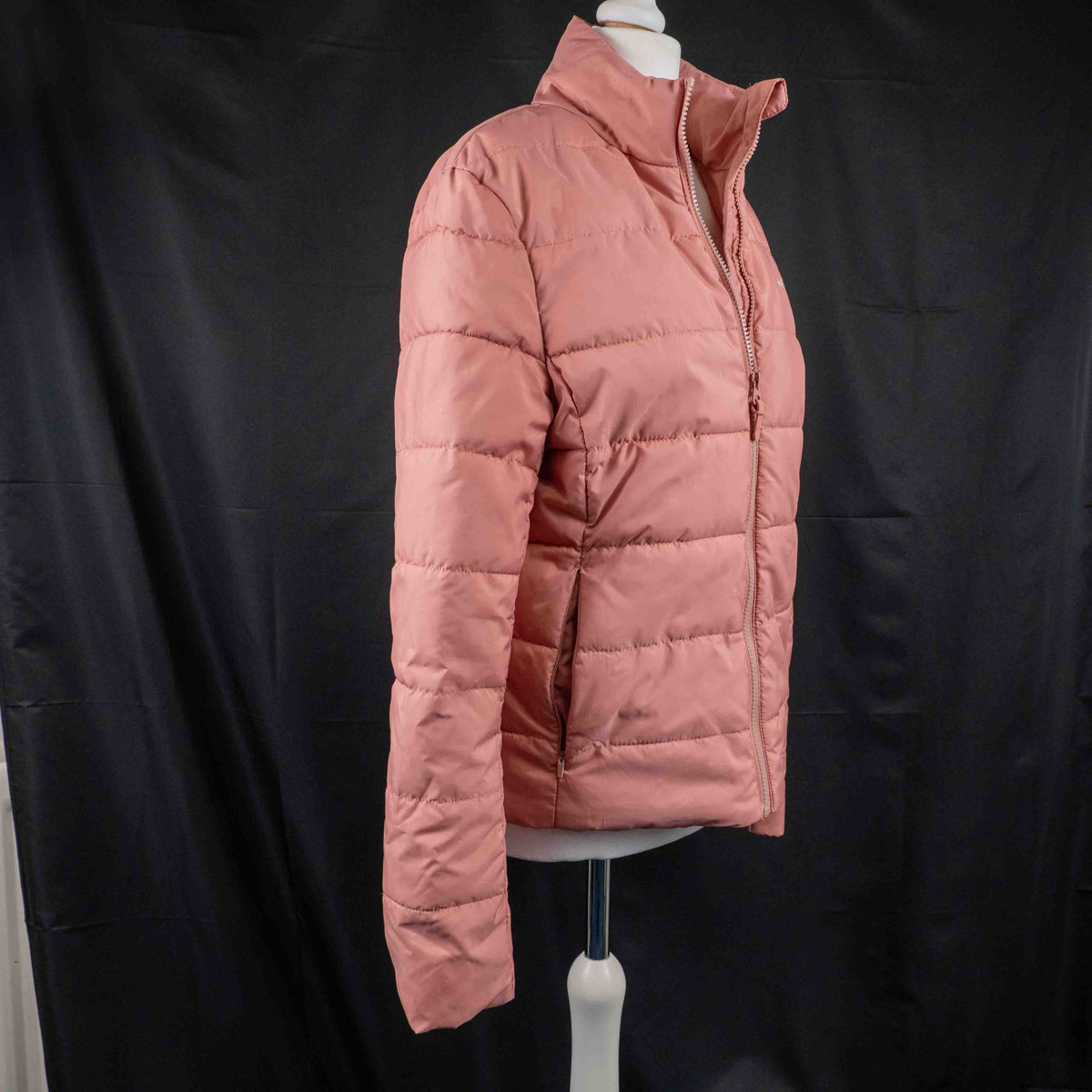 MP pink zip up puffer jacket with horizontal quilting and minimal logo on chest.