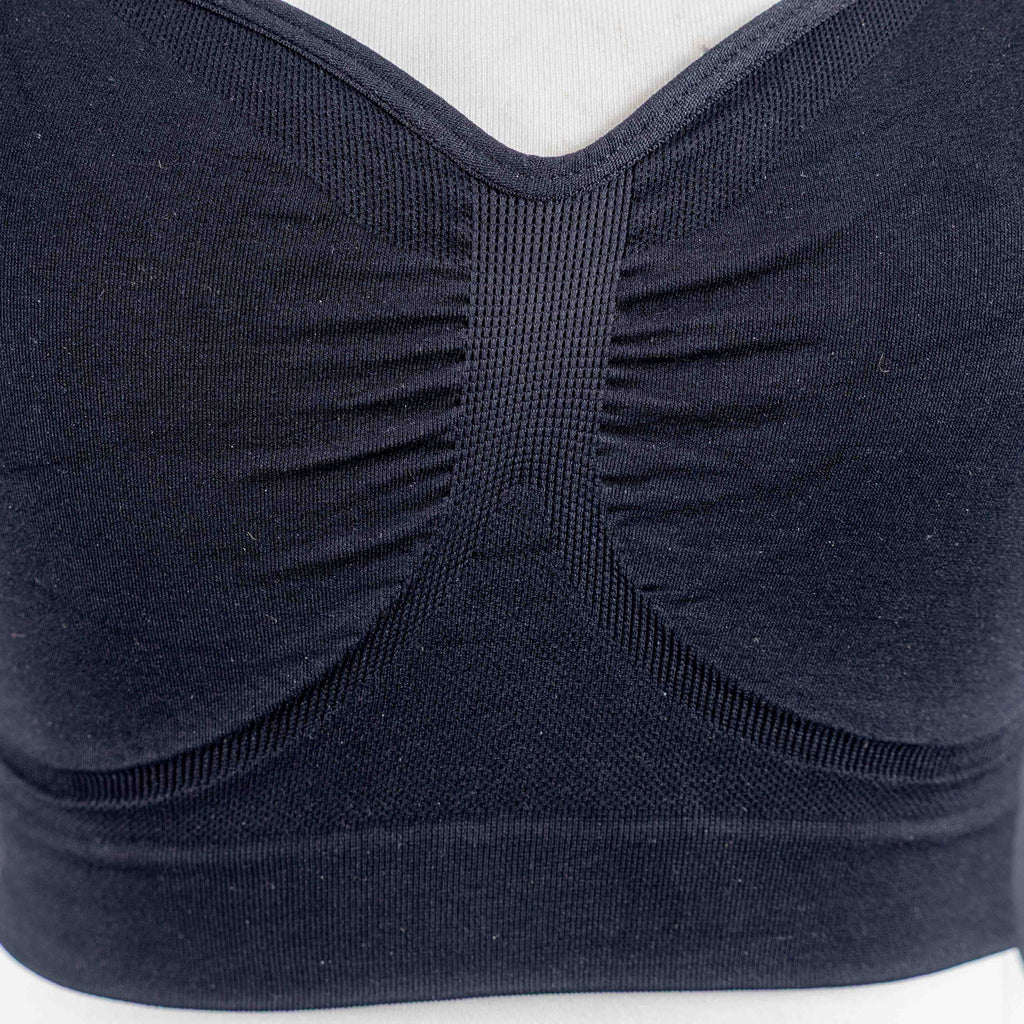 Dyversa black seamless bra with ruched center detail and adjustable straps.