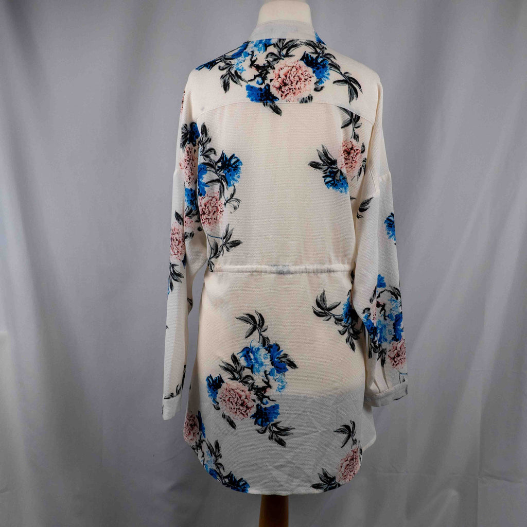 Boohoo white floral blouse with blue and pink prints, button front, drawstring waist.