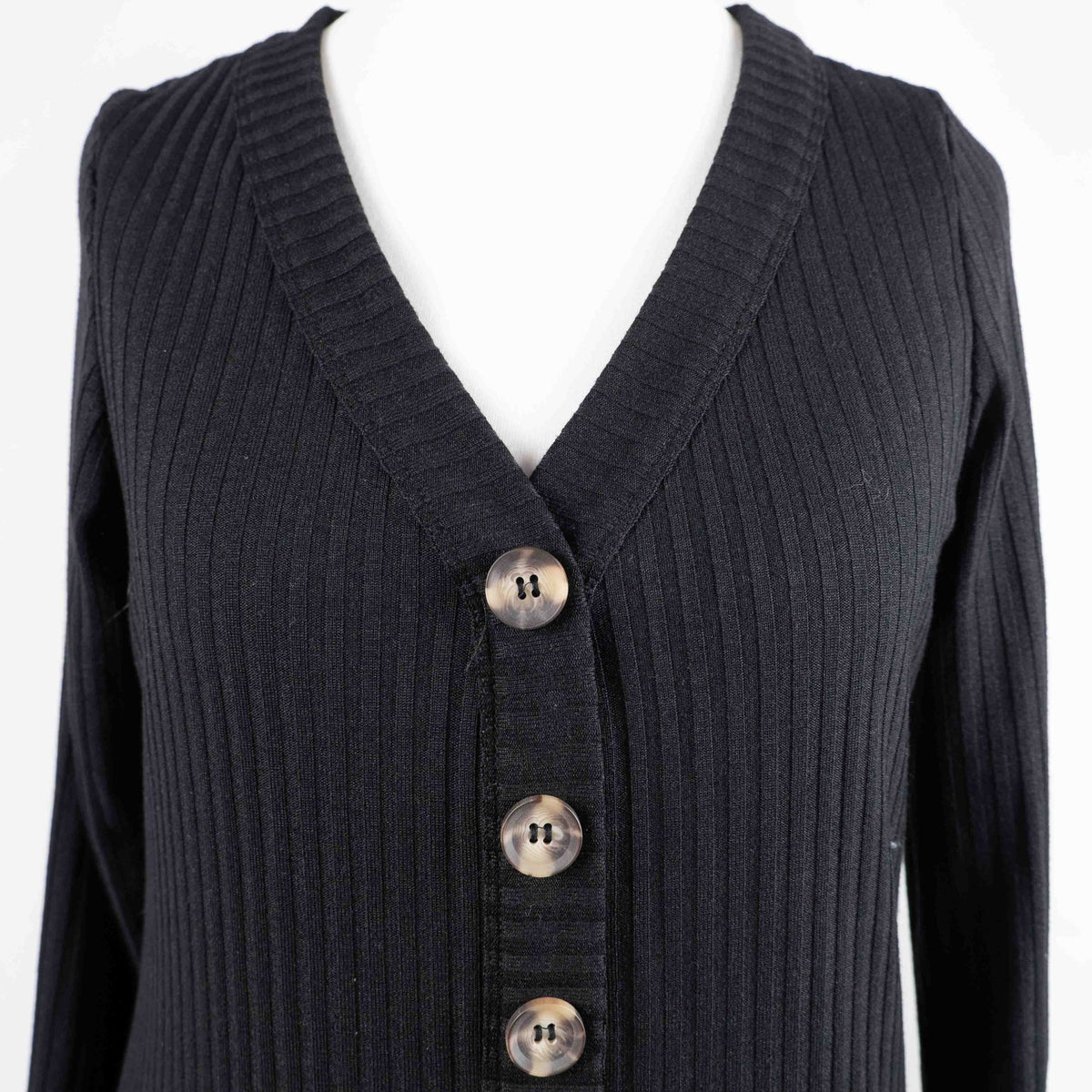 Unbranded black ribbed maxi dress with V neckline and three decorative front buttons.