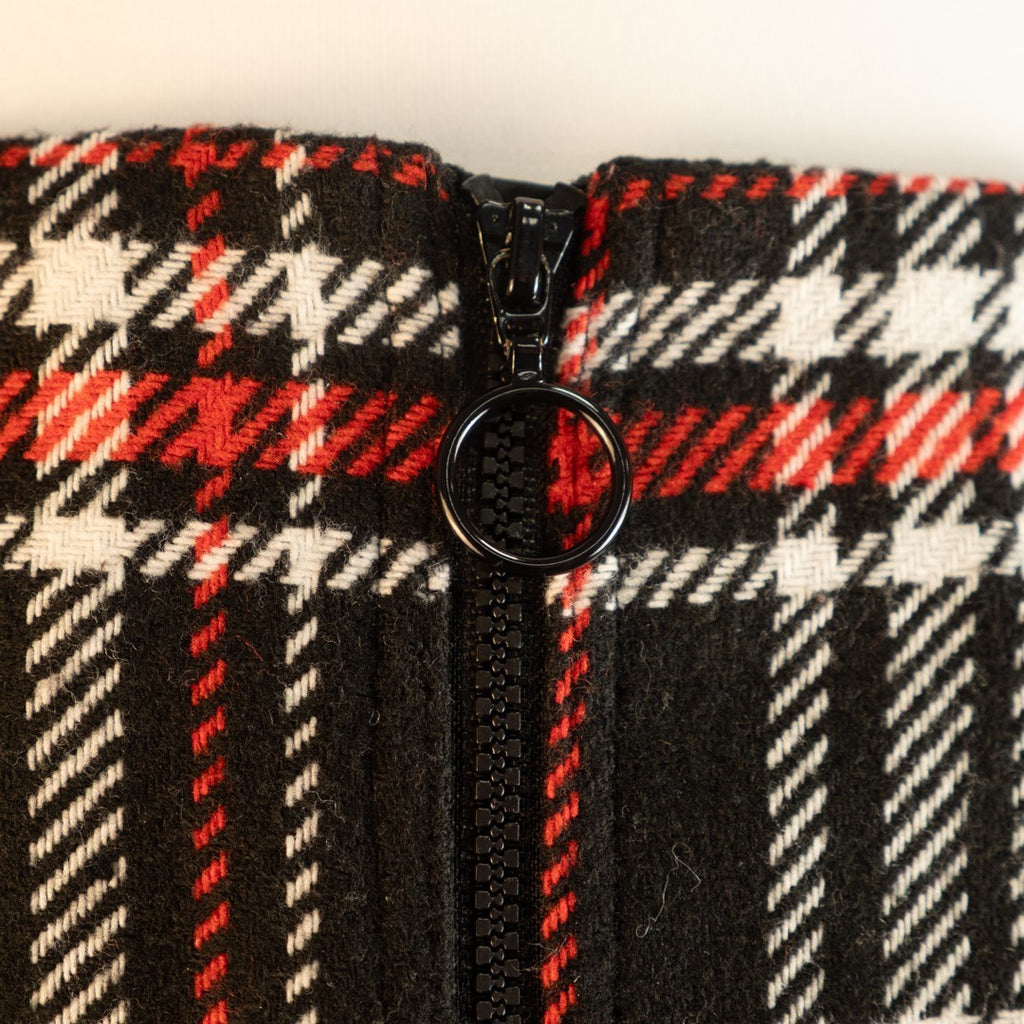 Papaya tan mini skirt black, red, and white checked pattern with zip and button closure.
