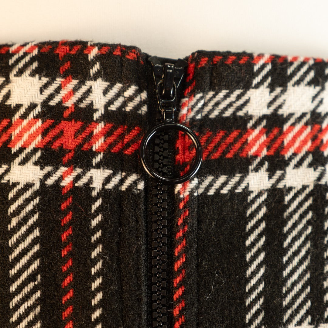 Papaya tan mini skirt black, red, and white checked pattern with zip and button closure.