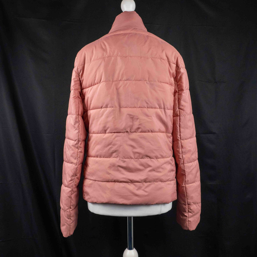MP pink zip up puffer jacket with horizontal quilting and minimal logo on chest.